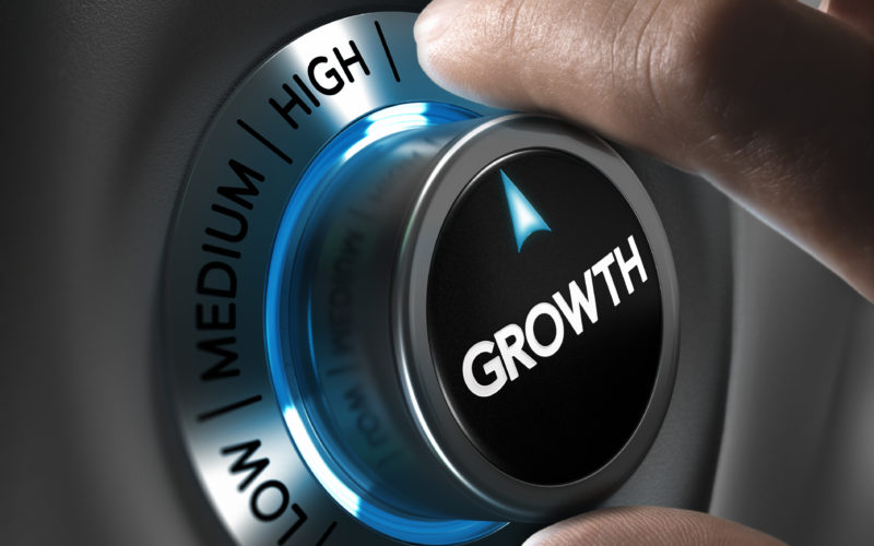 Growth Button Pointing The Highest Position With Two Fingers, Blue And Grey Tones, Conceptual Image For Business Or Economic Strategy